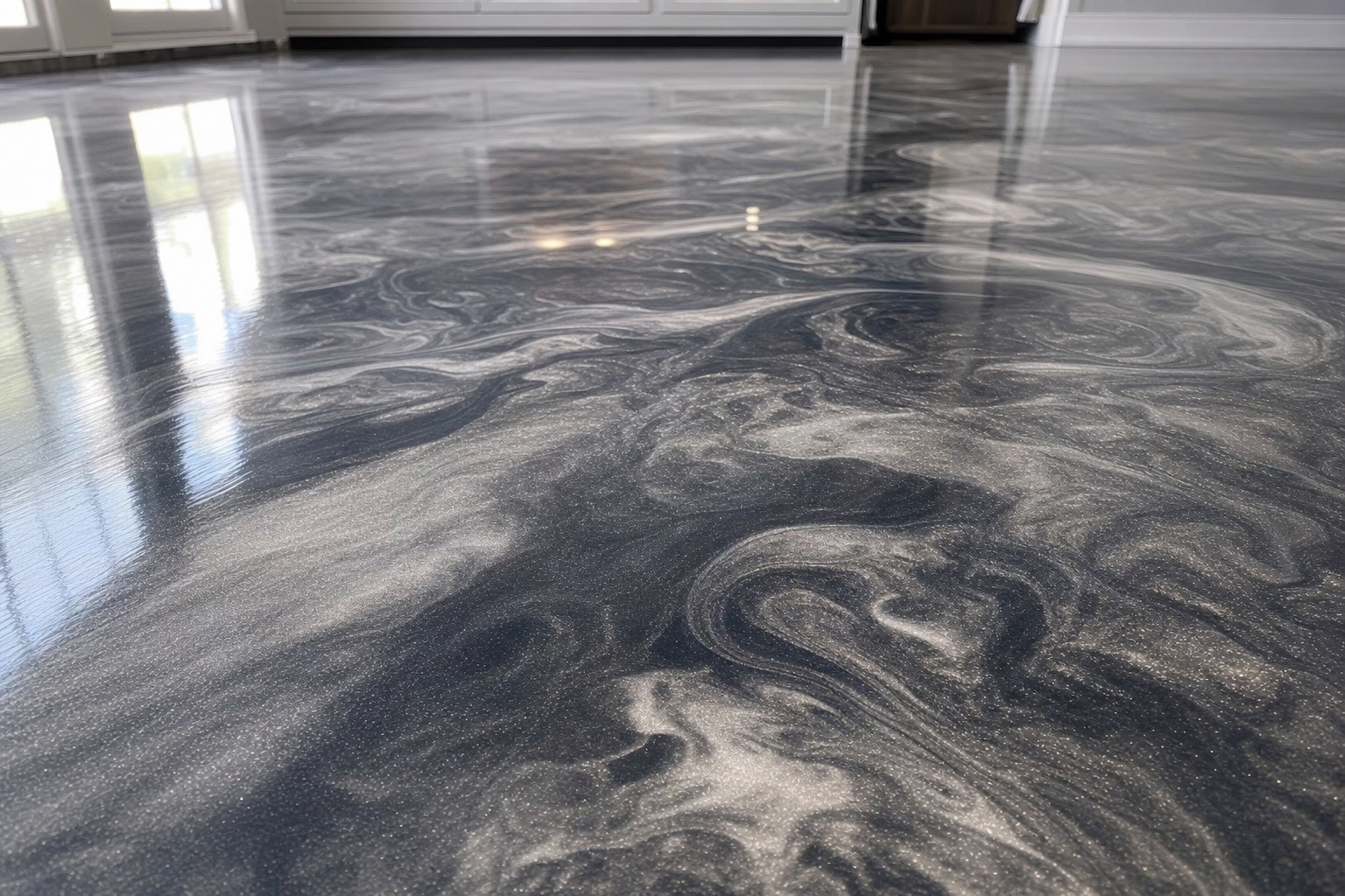 Close-up of a marbled metallic epoxy floor in charcoal and silver