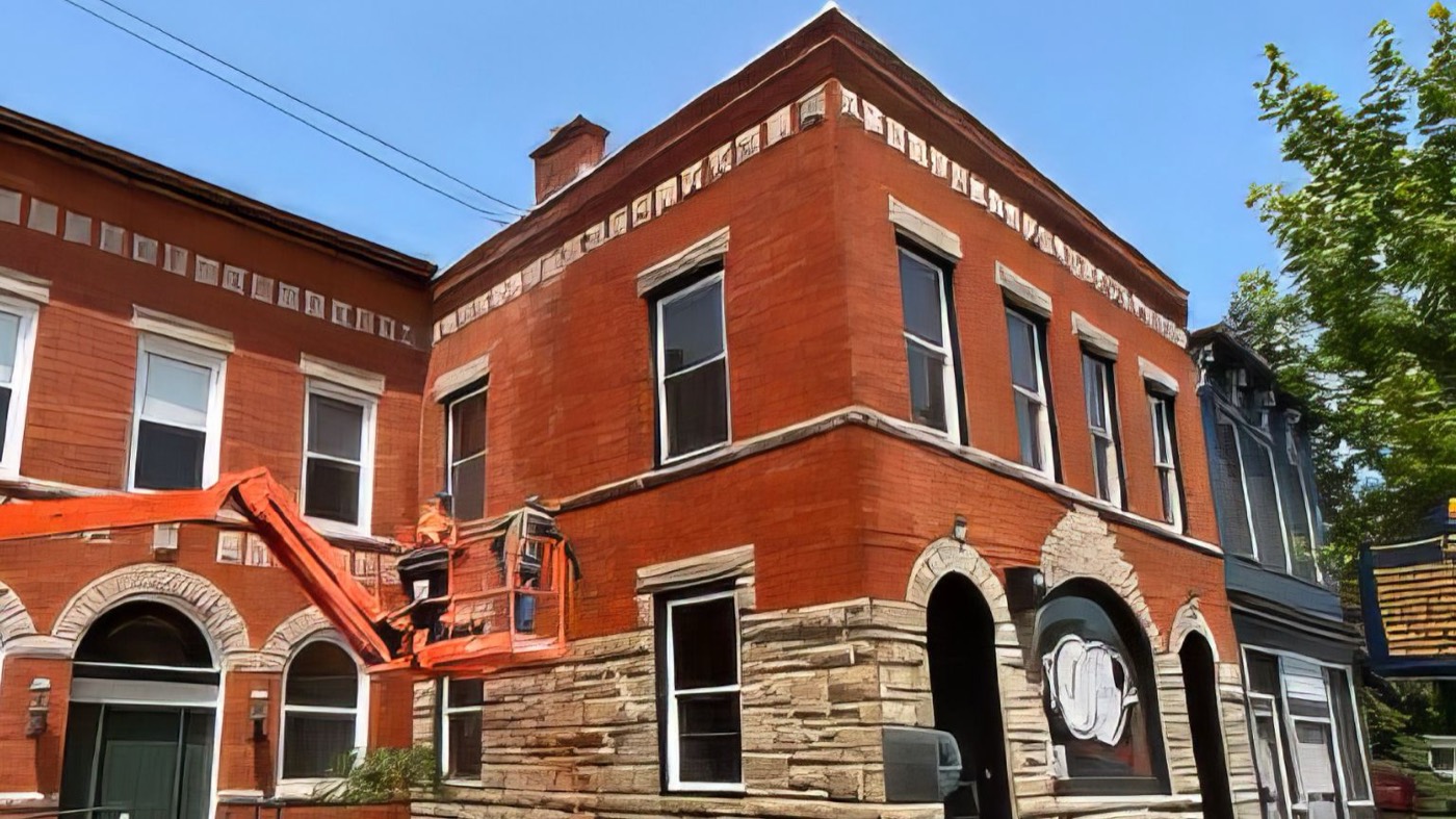 Downtown red-brick corner building restoration in progress